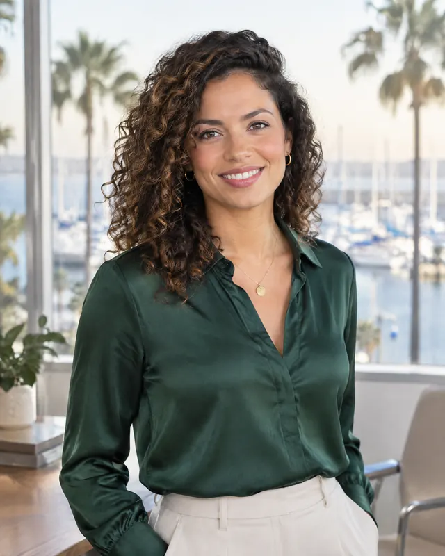 Camila Ortega, a Beacon advisor for Lakewood Ranch and Venice, in a deep green blouse